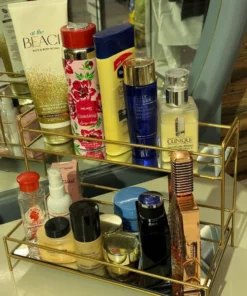 Elegant double-layer gold organizer with mirror - perfect for storing makeup, jewelry, and skincare while adding a luxurious touch to your vanity.