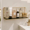 Golden metal wall mounted rack for bathroom storage and daily essentials