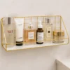 Golden metal wall mounted rack for bathroom storage and daily essentials